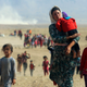 Displaced people from the minority Yazidi sect, fleeing violence from forces loyal to the Islamic State in Iraq.